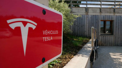 Tesla points and an electric charger